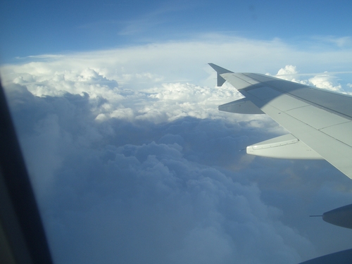 [Picture: Clouds, blue sky, shadows, wing]