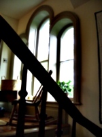 [picture: Rounded windows with rocking chair]
