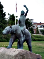 [picture: Sculpture: boy riding bear]