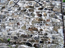 [Picture: Brown stone wall]
