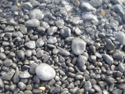 [Picture: Pebbles on the edge of the water]