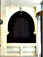 [picture: Arch with velvet curtain]