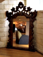 [picture: Mirror with ornate gold frame]