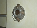 [Picture: Porthole Mirror with Candle]