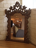 [Picture: Mirror with ornate gold frame]