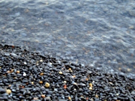 [picture: Wet pebbles at the edge of the shore 2]
