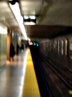 [picture: Blurred subway station platform]
