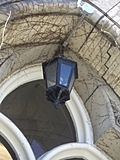 [Picture: Lantern in arched doorway]