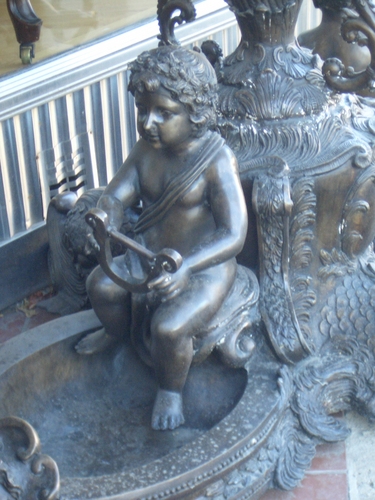 [Picture: Cherub statue]