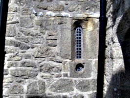 [picture: Castle window with gun hole]
