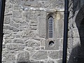 [Picture: Castle window with gun hole]