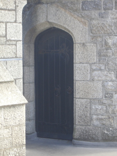 [Picture: Oak doorway in stone wall]