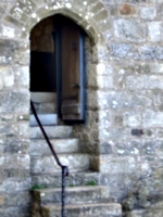 [Picture: Stone steps leading up to a chapel door]