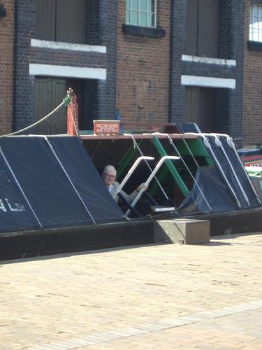 [Picture: Dad peeking out of a canal barge]