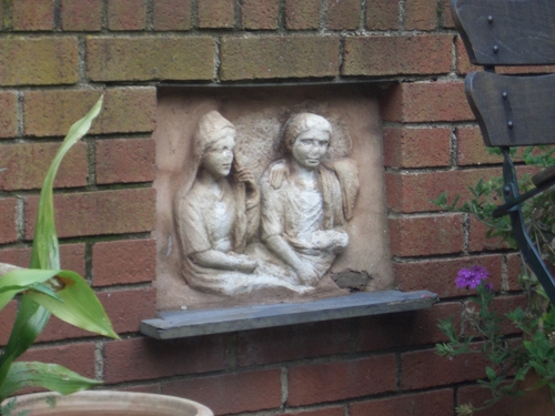 [Picture: bass-relief in the garden]