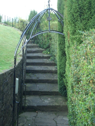 [Picture: Winding stone stairs in the garden]