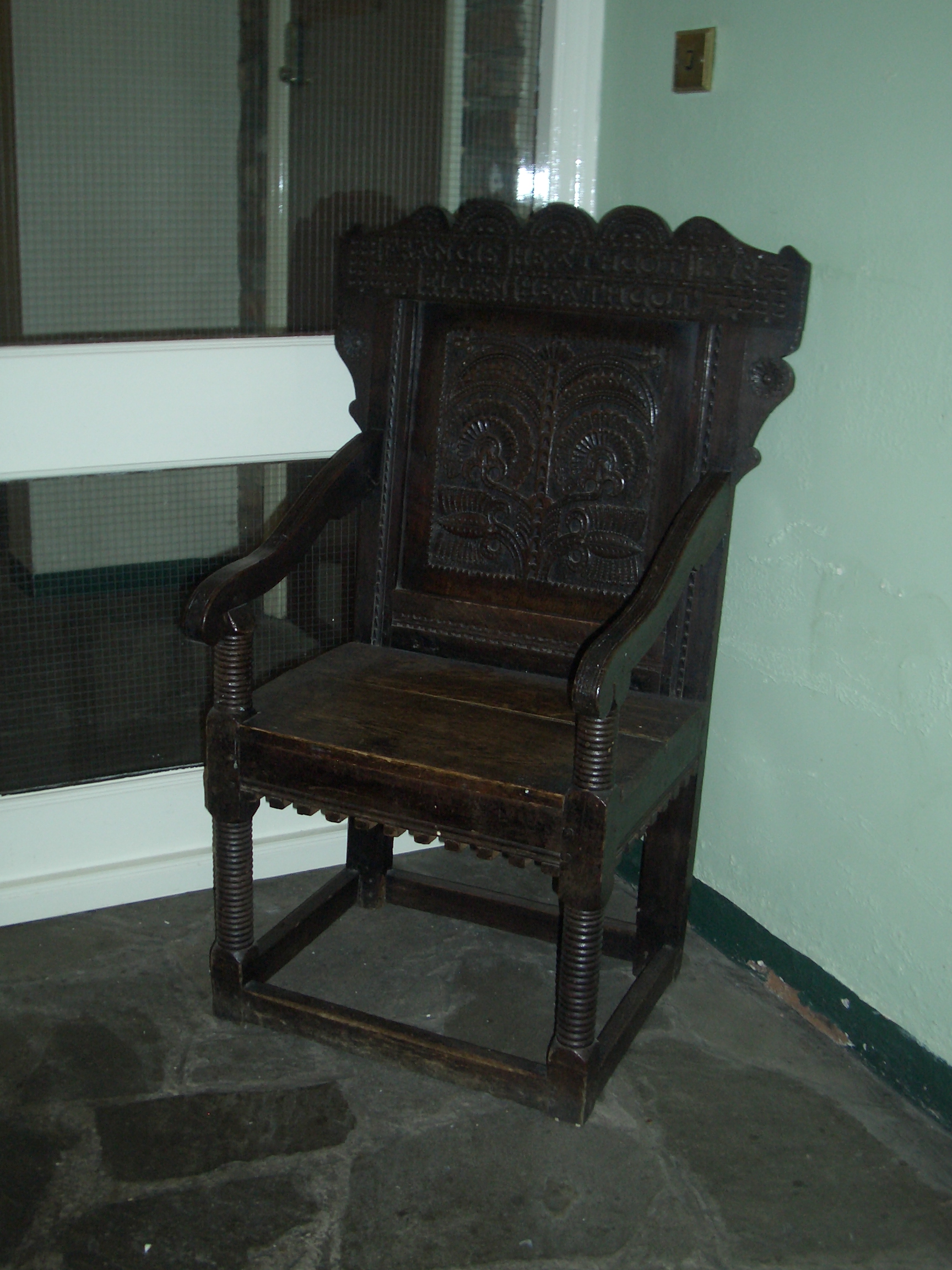 [Picture: ornate carved chair]