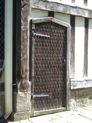 [Picture: Ancient studded oak door]