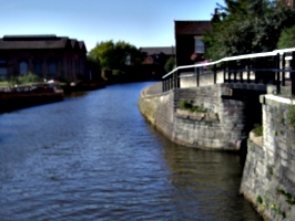 [picture: canal with footbridge]
