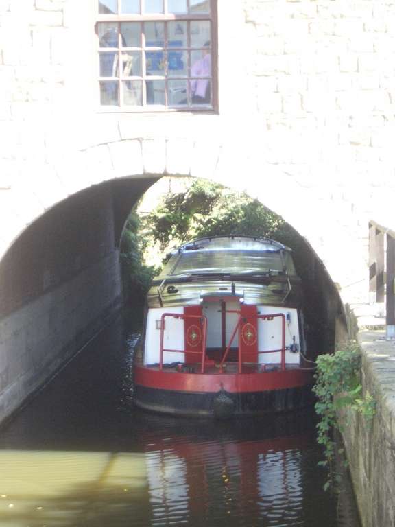[Picture: Canal boat under bridge]