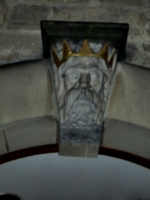 [picture: Stone head with gold crown]