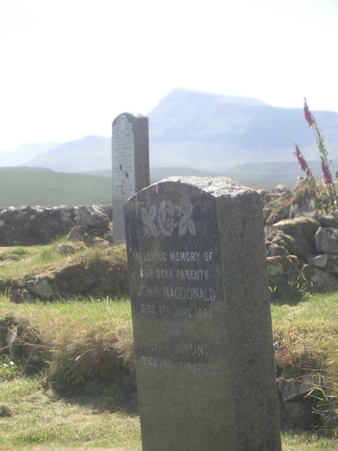 [Picture: Graves and flowers]