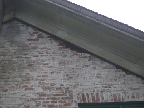 [Picture: Brick damage at the eaves]