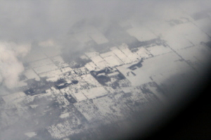 [picture: Snow-covered fields seen through clouds 1]