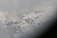 [Picture: Snow-covered fields seen through clouds 1]