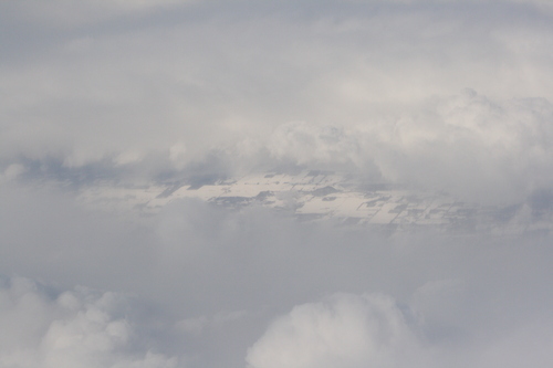 [Picture: Snow-covered fields seen through clouds 3]