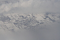 [Picture: Snow-covered fields seen through clouds 13]