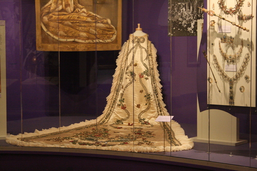 [Picture: Old Mardi Gras Costume with flowing train]