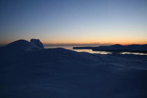 [Picture: Snowy shore at sunset]