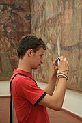 [Picture: Boy photographing fresco]