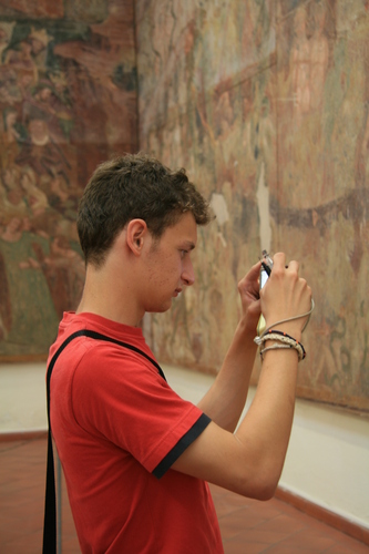 [Picture: Boy photographing fresco]