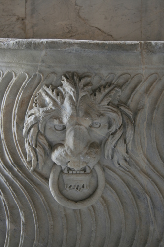 [Picture: Stone lion’s head with ring 2]