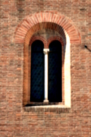 [picture: Church of San Giorgio dei Tedeschi 1: Arched window in brick wall]
