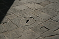 [Picture: Stone man-hole cover]