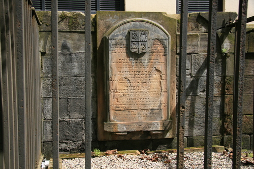 [Picture: Weathered tombstone]