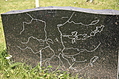 [Picture: Tombstone with a map]