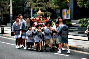 [picture: Children carrying the mikoshi]