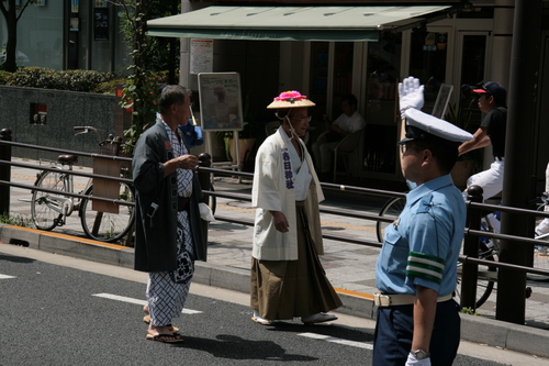 [Picture: Man and Lady in the procession]