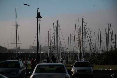 [Picture: Parked boats, cars and people]
