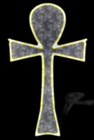 [picture: Granite ankh cross with gold trim and a perspective shadow, on a black background]